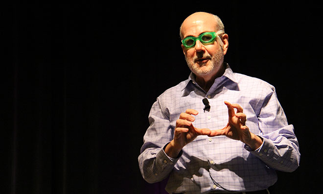 Gregerman talks freestyle swimming with the help of some goggles. (Sabrina A. Kidwai, APR, CAE)