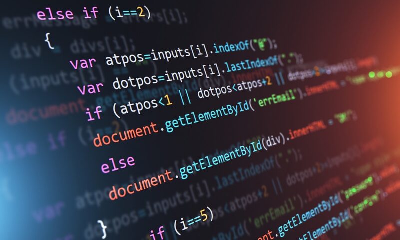 Creative abstract PHP web design, internet programming HTML language and digital computer technology business concept: 3D render illustration of the macro view of software source code on screen monitor with selective focus effect