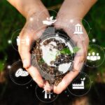 two hands holding the earth surrounded by ways to address climate change