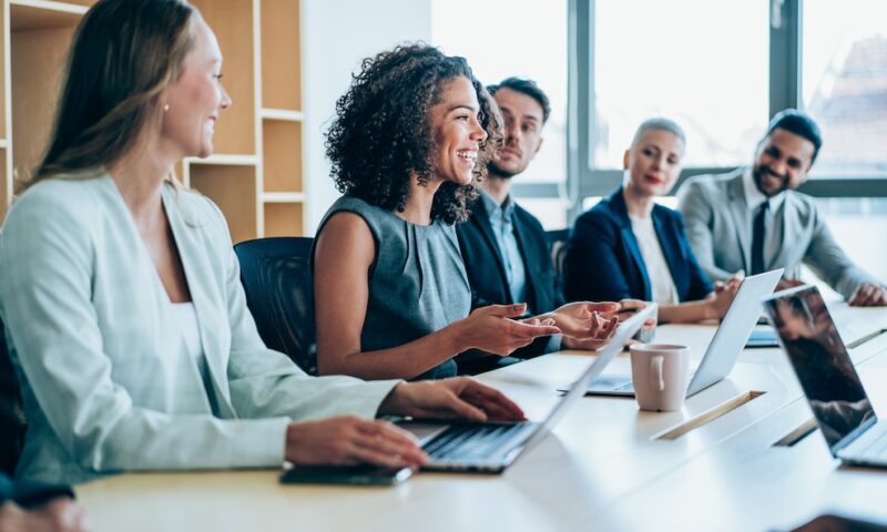 Group of business persons in business meeting. Group of entrepreneurs on meeting in board room. Corporate business team on meeting in the office.