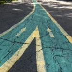 Close up arrow signs on asphalt city road
