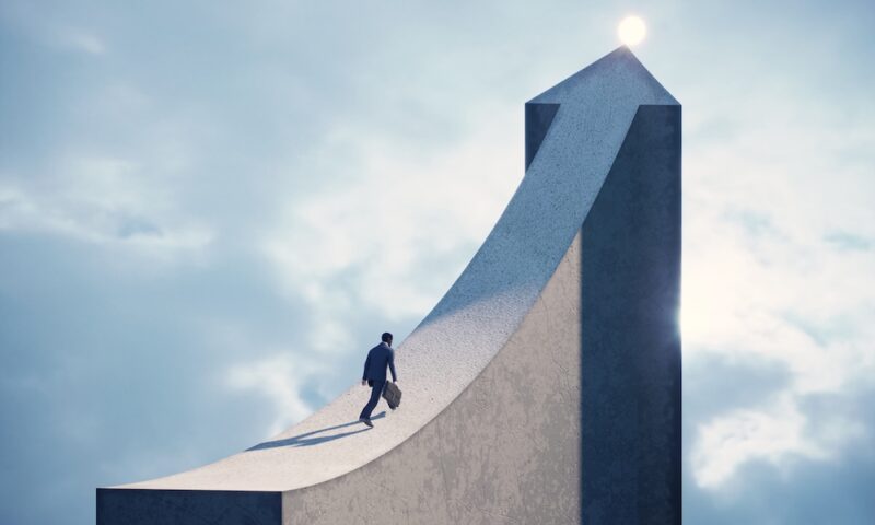 Business man running on arrow shaped bridge to the top light. (3d render)