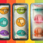 Slot machine / one arm bandit with thumbs up and down as like and dislike icons on the three spinning wheels. Two wheels are stationary and the third is still spinning with motion blur. The machine has signs of wear and tear. The icons are a mixtures of pastel colours.