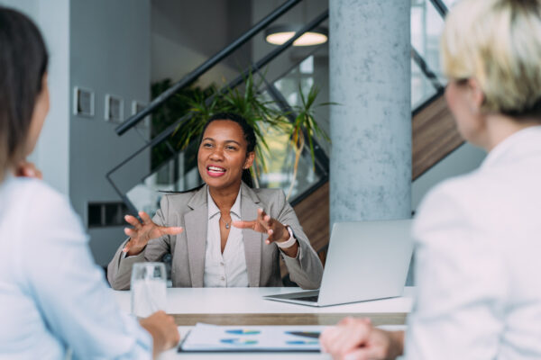 Shot of group of businesswomen in business meeting. Three female entrepreneurs on meeting in board room. Corporate business team on meeting in modern office. Female manager discussing new project with her colleagues. Company owner on a meeting with two of her employees in her office.