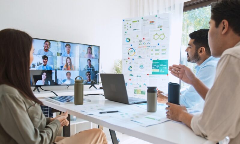 Young group of Asian businesspeople in team meeting, online video conference call on ESG (Environmental, social, corporate governance) discussion. Sustainable business practice, people work at home