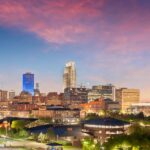 Omaha, Nebraska, USA downtown cityscape at dusk.
