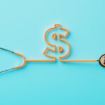 Orange stethoscope forming a dollar sign on blue background.