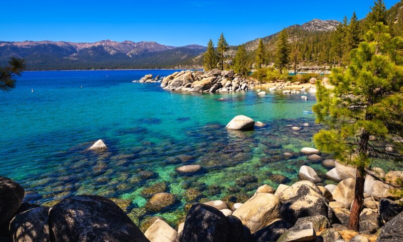 Sand Harbor Beach at Lake Tahoe, Nevada State Park, with Sierra Nevada Mountains in the background.