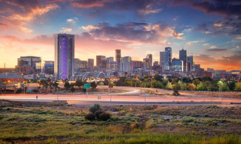 Cityscape image of Denver skyline, Colorado, USA at dramatic summer sunrise.