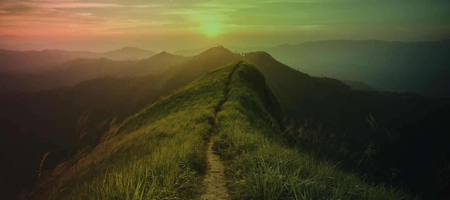 The way of climax. Mountain slope have a way for walk. Background is sunset.
