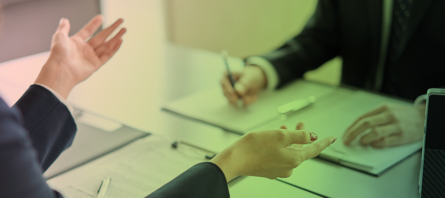 Hand of a business woman giving an explanation at a meeting