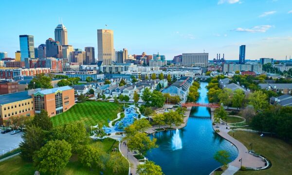 Aerial View of Vibrant Indianapolis Cityscape with Serene Park and Waterway at Golden Hour