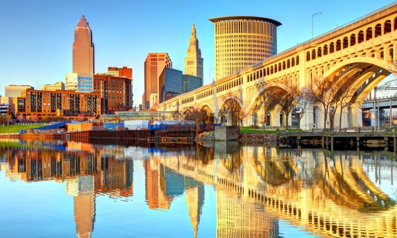 Cleveland Skyline reflecting on the Cuyahoga River - stock photo